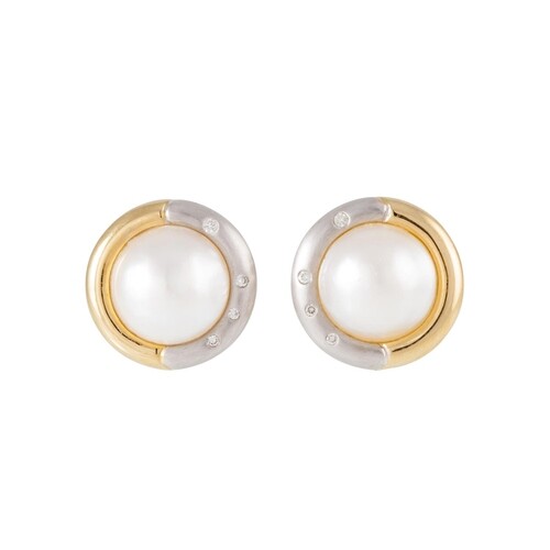 A PAIR OF DIAMOND AND MABE PEARL EARRINGS, the pearls to two...