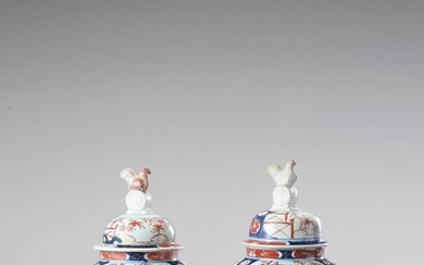 A PAIR OF IMARI PORCELAIN VASES AND COVERS