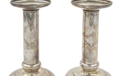 A PAIR OF STERLING OF SILVER CANDLESTICKS IN STYLISH...