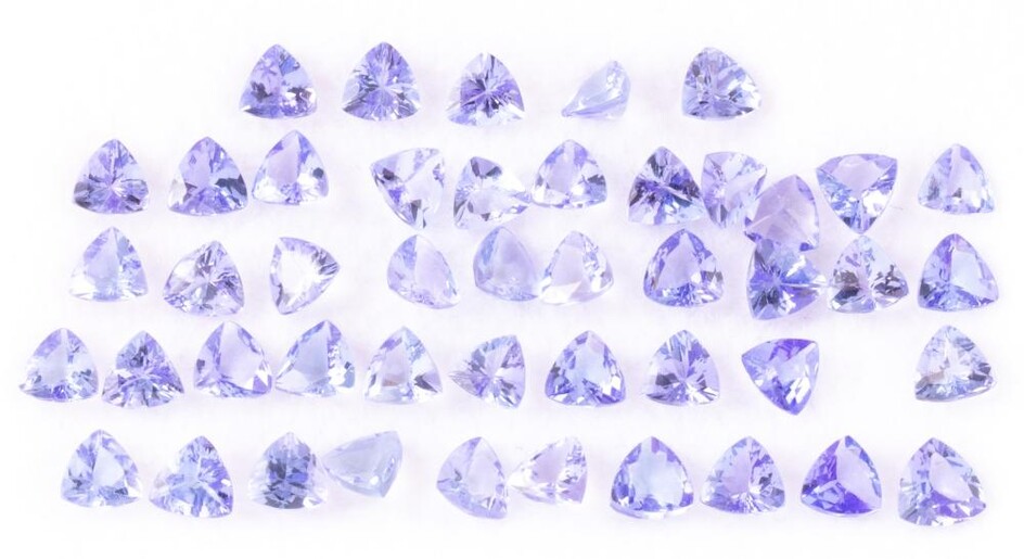A PARCEL OF UNSET TANZANITES; 46 trilliant cut gemstones total 10.74ct.