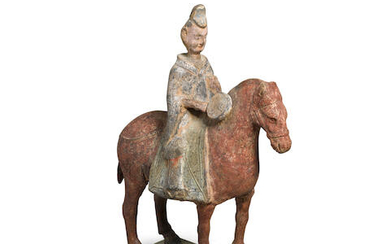 A Painted Pottery Figure of Horse and Rider