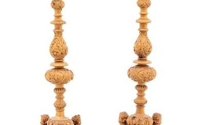 A Pair of Continental Carved Wood Prickets