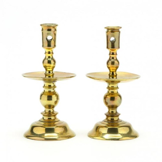A Pair of Early Brass Candlesticks