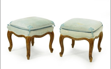 A Pair of Louis XV Style Carved Walnut Foot Stools.