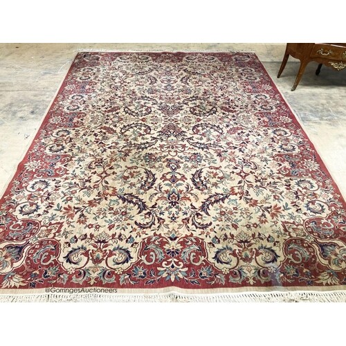 A Persian style ivory ground carpet, 380 x 280cm ...