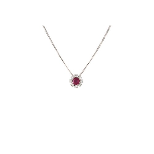 A RUBY AND DIAMOND CLUSTER PENDANT, of circular form, mounte...