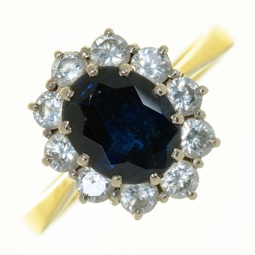 A SAPPHIRE AND DIAMOND CLUSTER RING IN 18CT GOLD, LONDON 198...