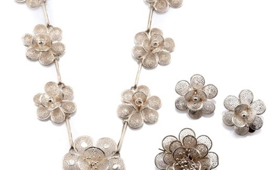 A SILVER JEWELLERY SUITE; necklace, brooch and clip earrings all featuring cannetille style floral clusters, necklace length 45cm.