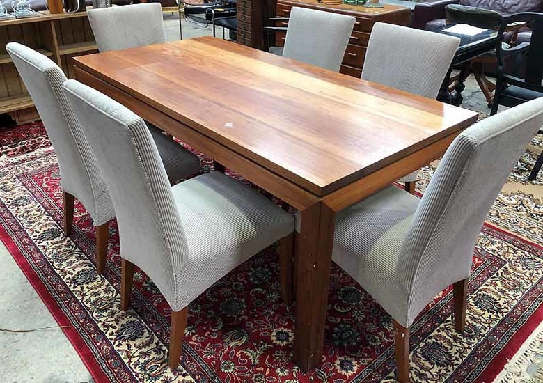 A SOLID TIMBER DINING TABLE WITH SIX CHAIRS