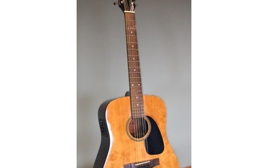 A Samick acoustic 12 string SW 115-12 guitar, made in Korea,...