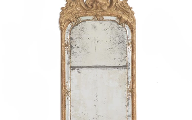 A Swedish Rococo giltwood mirror; richly carved. Original bevelled mirror glass. Ca....