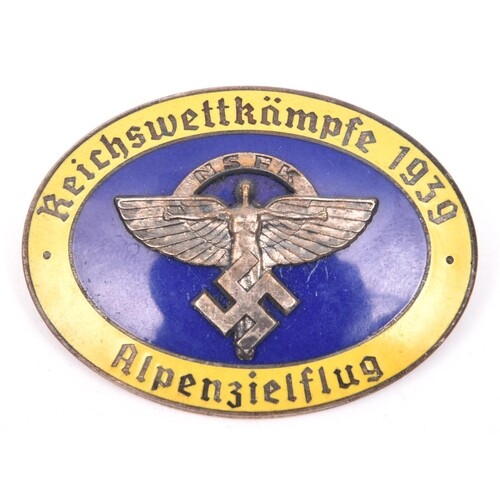 A Third Reich oval enamelled pin back badge, superimposed i...