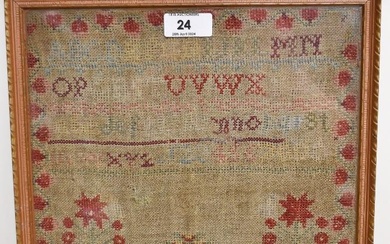 A Victorian needlework alphabet sampler, stitched by Jane Reed, framed and under glass, measuring
