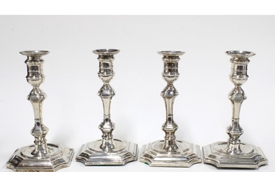 A Victorian set of four silver candlesticks, Hawksworth, Eyr...