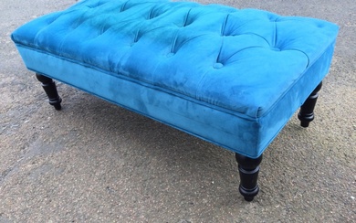 A Victorian style upholstered ottoman stool with regular buttoned seat...