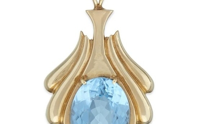 A blue topaz and fourteen karat gold pendant