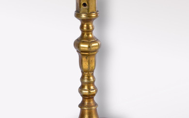 A bronze candlestick, 16/18th century.