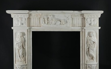 A carved white marble fireplace