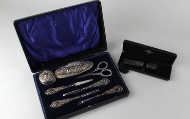 A cased George V silver manicure set