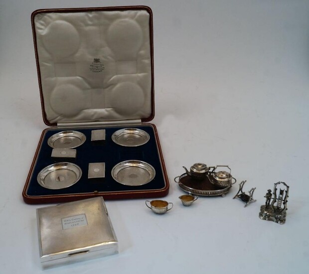 A cased set of four silver ashtrays and three matchbox covers, one matchbox cover missing, London, 1929, William Comyns & Sons Ltd, with engine turned decoration and vacant circular cartouches, the fitted case with interior marked SKINNER & CO...