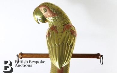 A charming cast brass and copper parrot, crafted with...