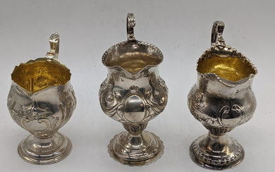 A collection of 3 George III silver cream jugs,...