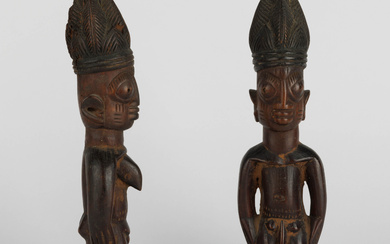 A fine pair of Yoruba ibeji. Depicting a man and a woman. Nigeria, early 20th century.