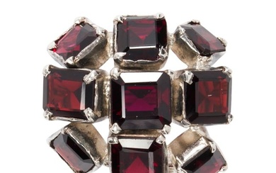 A garnet and silver ring