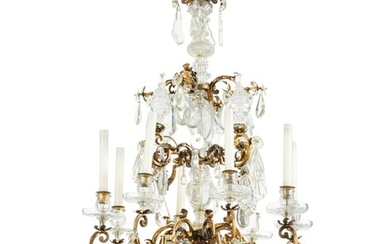 A gilt metal and cut rock crystal chandelier, partly French Régence, circa 1720 and later | Lustre en métal doré à l'huile et pendeloques en cristal taillé en partie d'époque Régence, vers 1720 et plus tard