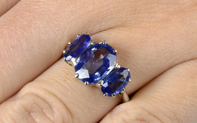 A graduated oval-shape Sri Lankan sapphire three-stone ring.