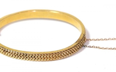 A hinged bangle, unmarked, measures 5.9cm by 4.9cm