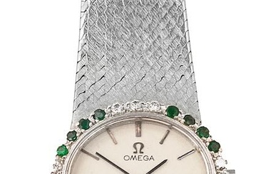 A lady's Omega wrist watch with diamond and emerald bezel