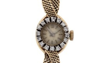 A lady's gold and diamond set bracelet watch, c. 1950 the dial with single cut diamond bezel and baton markers to integral mesh bracelet of woven design, Swiss 17 jewel manual wind movement, clasp and case stamped 750, bracelet length approx...