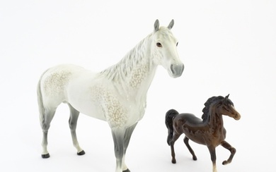 A large Beswick dapple grey hunter horse. Together with a Be...