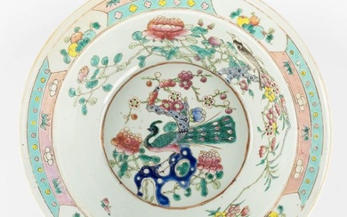 A large Chinese bowl, Famille Rose decorated with a Peacock and blossoms. 19th century. (H:12,5 x