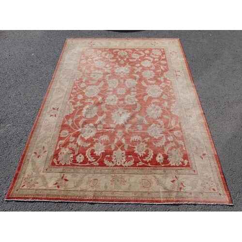 A large Ziegler style cream and red woollen Carpet 374cm x 2...