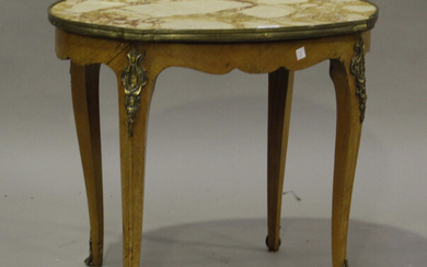 A late 19th/early 20th century French walnut shaped oval occasional table with gilt metal mounts, th