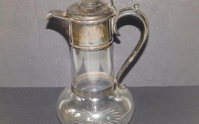 A late Victorian silver mounted glass claret jug of...