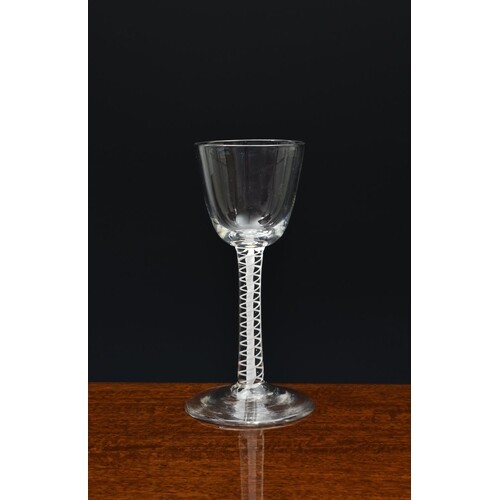 A mid-18th century airtwist wine glass, c.1750-60, with roun...