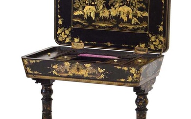 A mid-19th century black lacquered and gilt sewing table intricately...