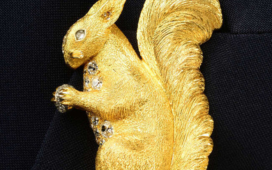 A mid 20th century 18ct gold old-cut diamond squirrel brooch, holding a rose-cut diamond nut, by René Boivin.