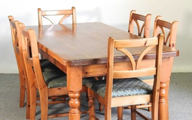 A modern pine dining table, on turned legs, together with...