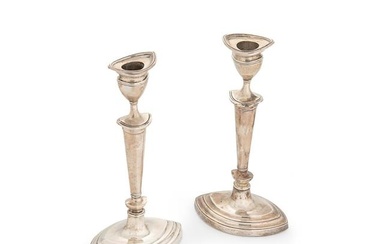 A pair of Edward VII silver library candlesticks