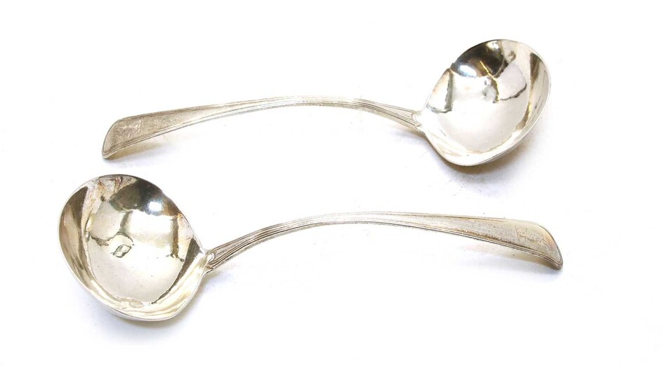 A pair of George III Old English pattern and thread silver sauce ladles