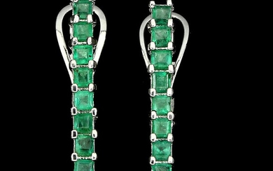 A pair of emerald ear pendants each set with numerous emerald-cut emeralds, mounted in rhodium plated sterling silver. L. 2.3 cm. (2)