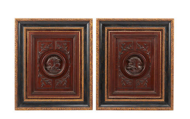 A pair of framed continental carved wood panels