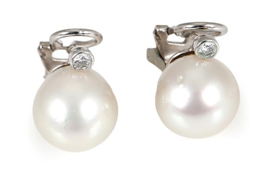 A pair of pearl and diamond ear studs each set with a...