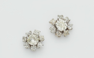 A pair of platinum and European old-cut diamond cluster stud earrings.