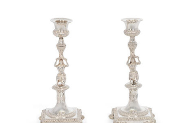A pair of silver figural candlesticks