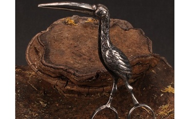 A pair of silver novelty ribbon threaders, cast as a stork, ...